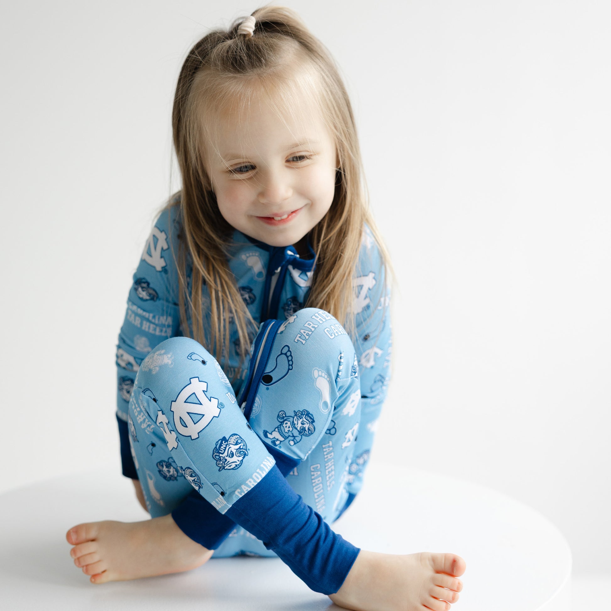 UNC Tar Heels baby zip sleeper featuring officially licensed collegiate design