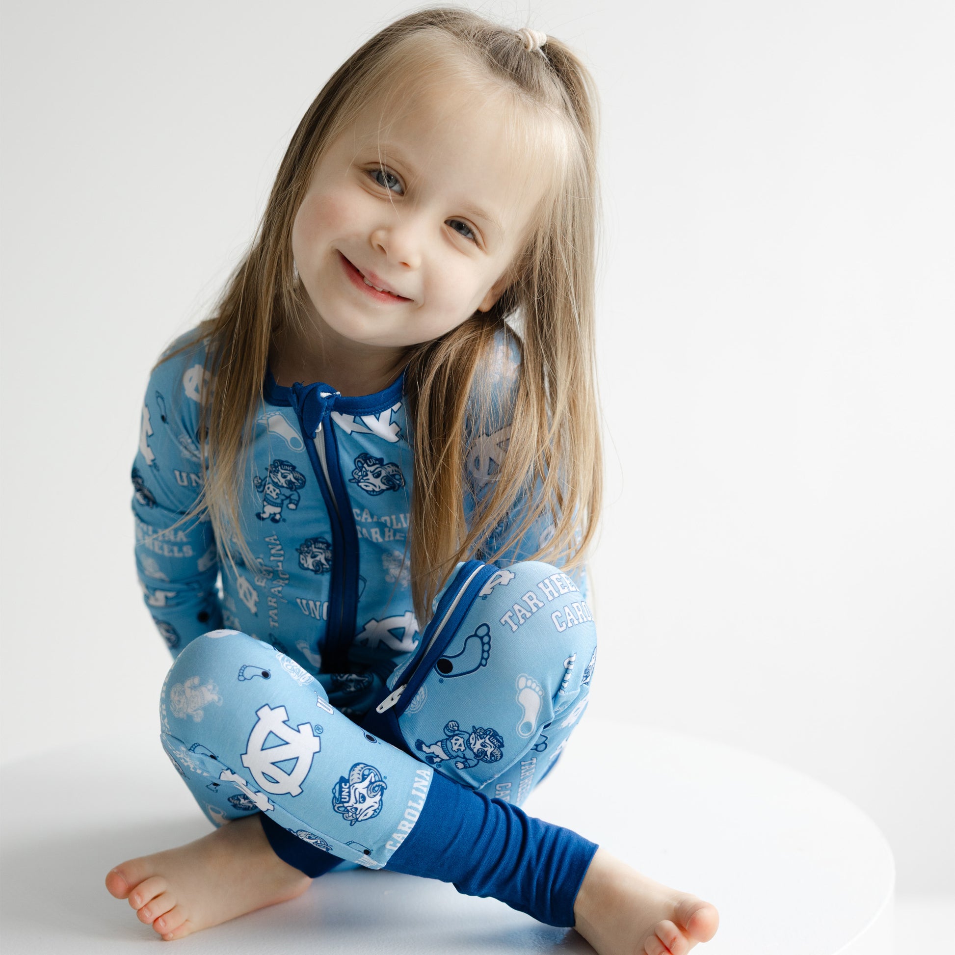 North Carolina Tar Heels infant bamboo one-piece sleeper with all-over Tar Heels print