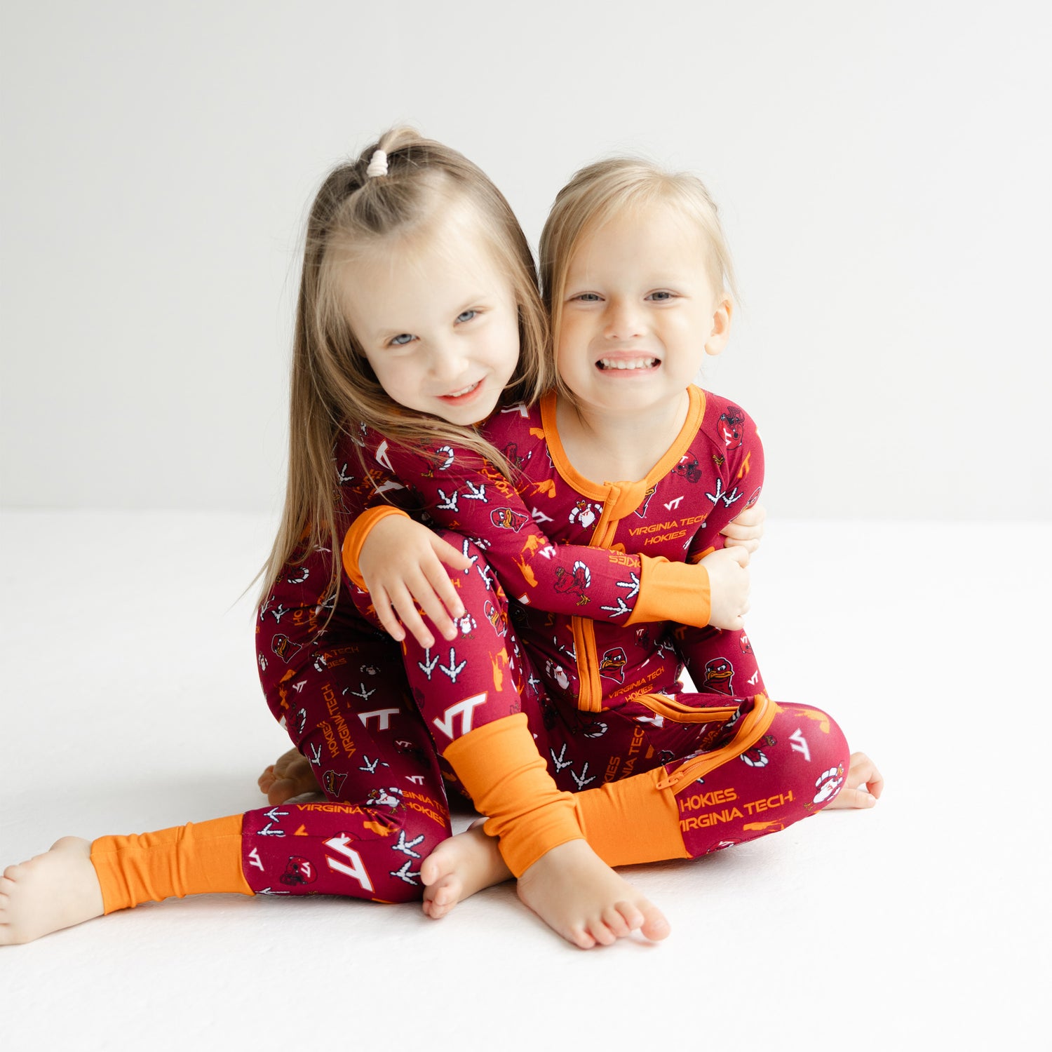 Virginia Tech Hokies zipper one-piece sleeper featuring all-over officially licensed team logos.