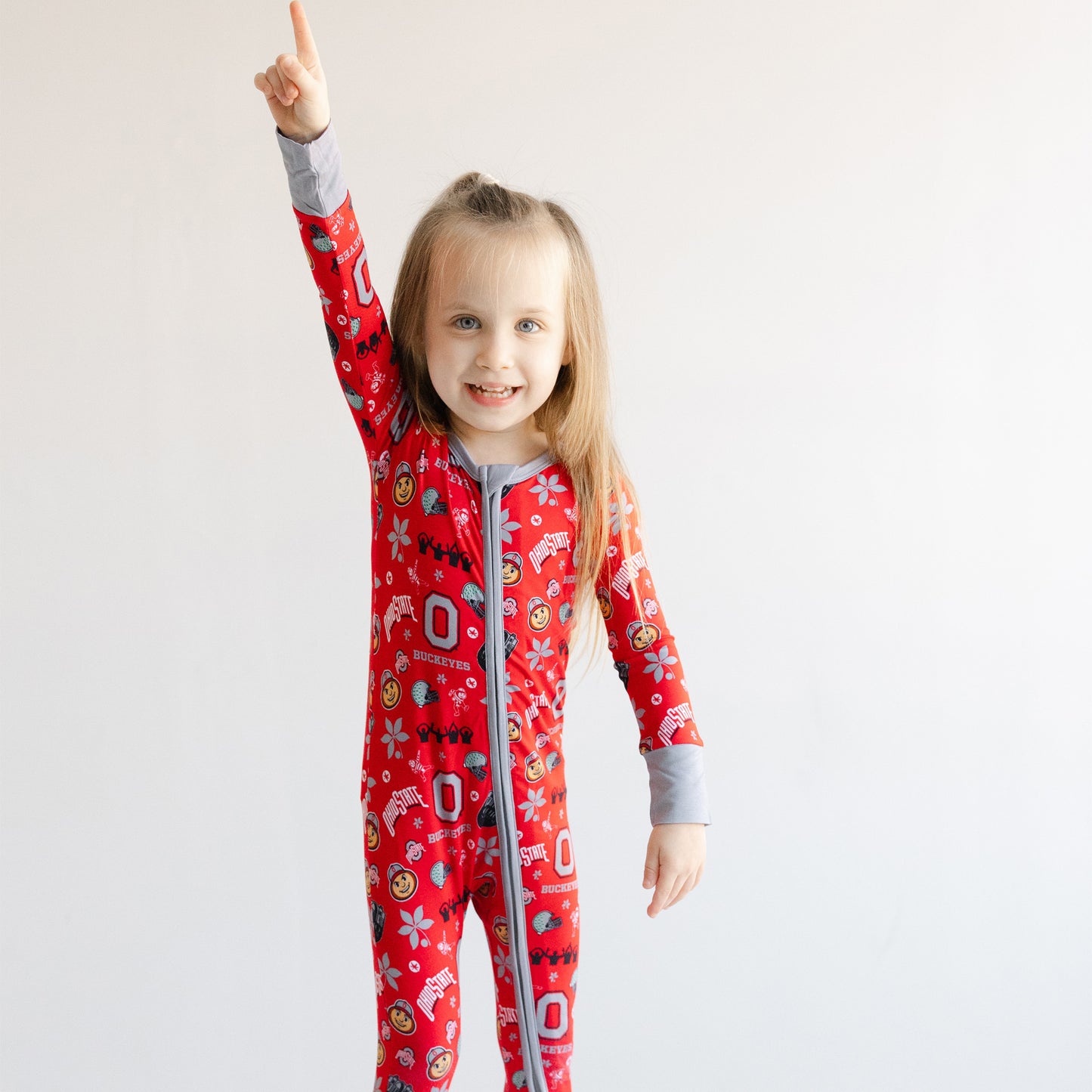 Toddler in a Go Bucks zippy one-piece sleeper