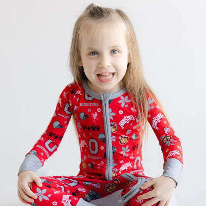 Toddler in a scarlet Ohio State Buckeyes zippy one-piece sleeper