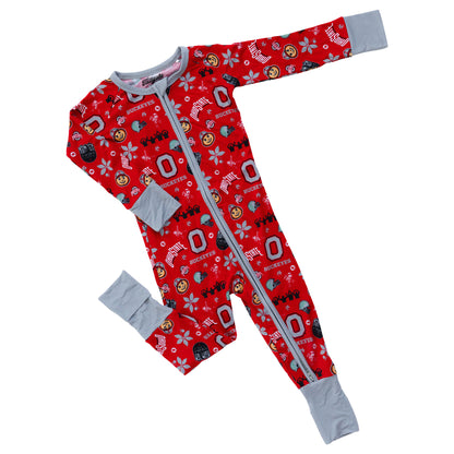 A baby long-sleeve footless one-piece sleeper with a red background covered in Ohio State Buckeyes logos and graphics, featuring light gray cuffs and a light gray zipper.