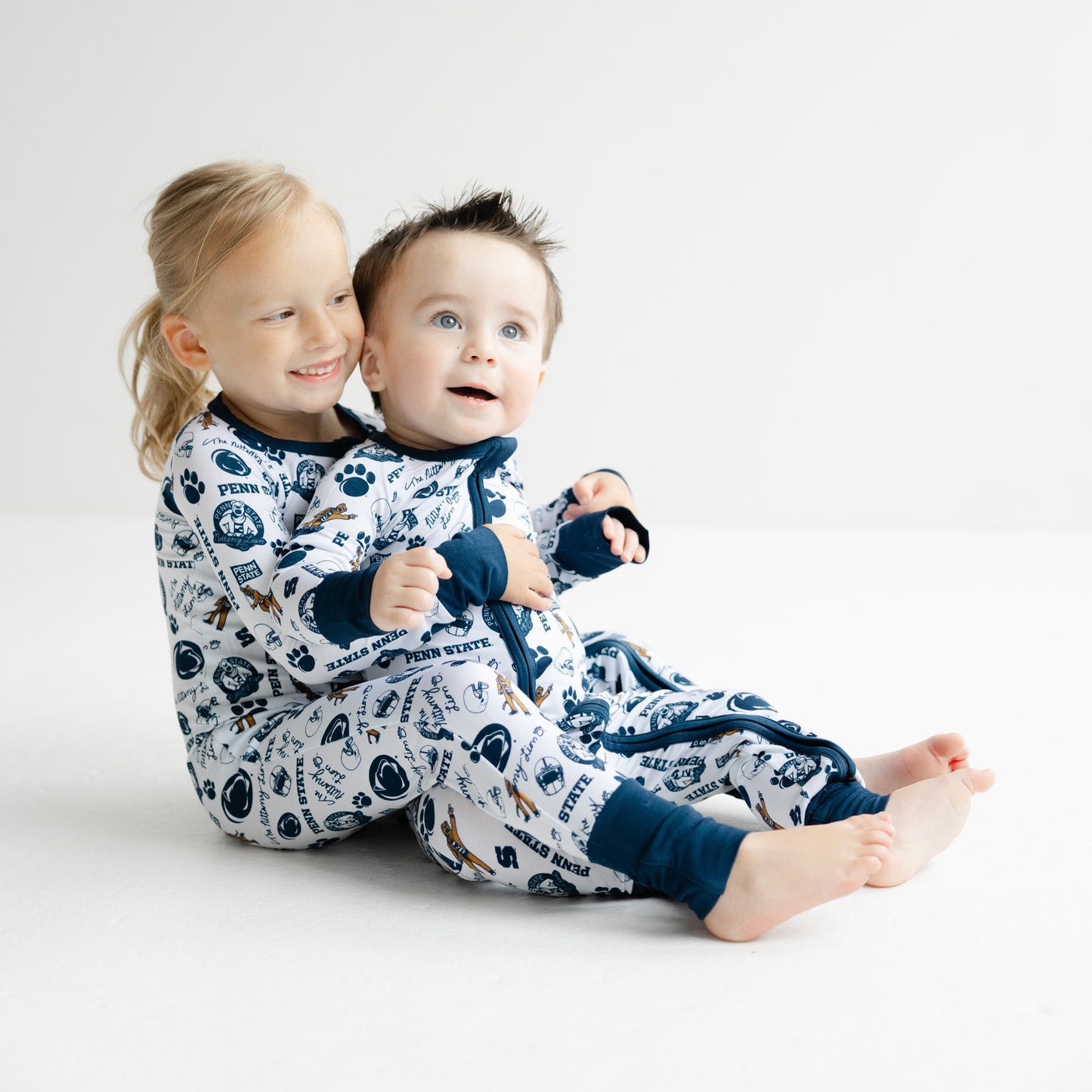 Baby wearing Penn State Nittany Lions zippy sleeper in soft bamboo fabric