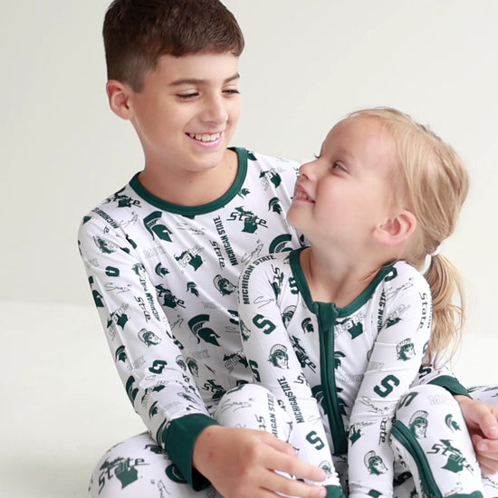 Michigan State Spartans baby and toddler pajama set featuring a long-sleeve top and matching pants.