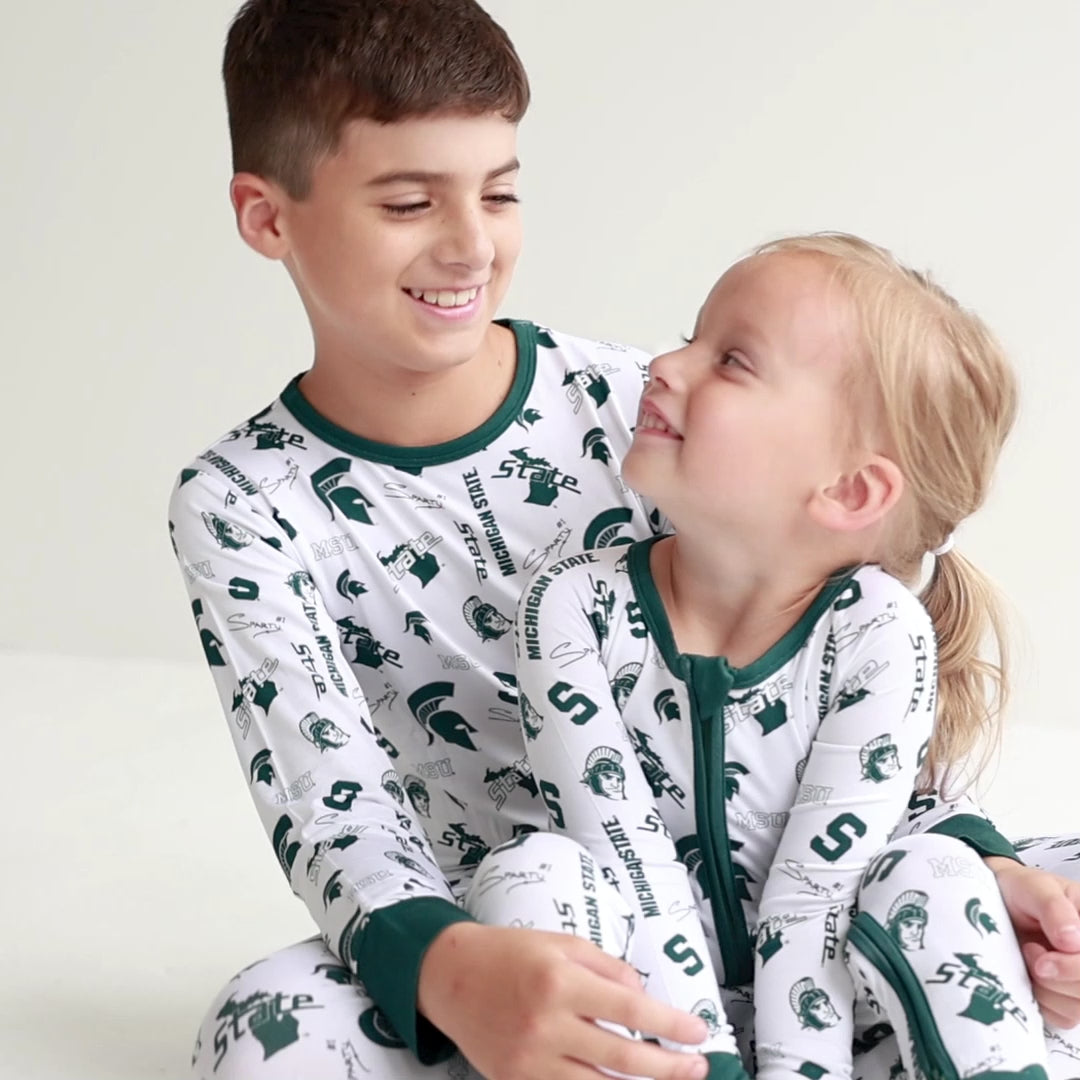 Michigan State Spartans baby and toddler pajama set featuring a long-sleeve top and matching pants.