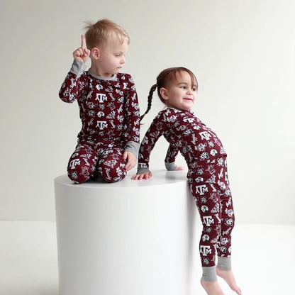 Texas A&M Aggies zippy one-piece sleeper and two-piece pajama set shown together for little Aggies fans