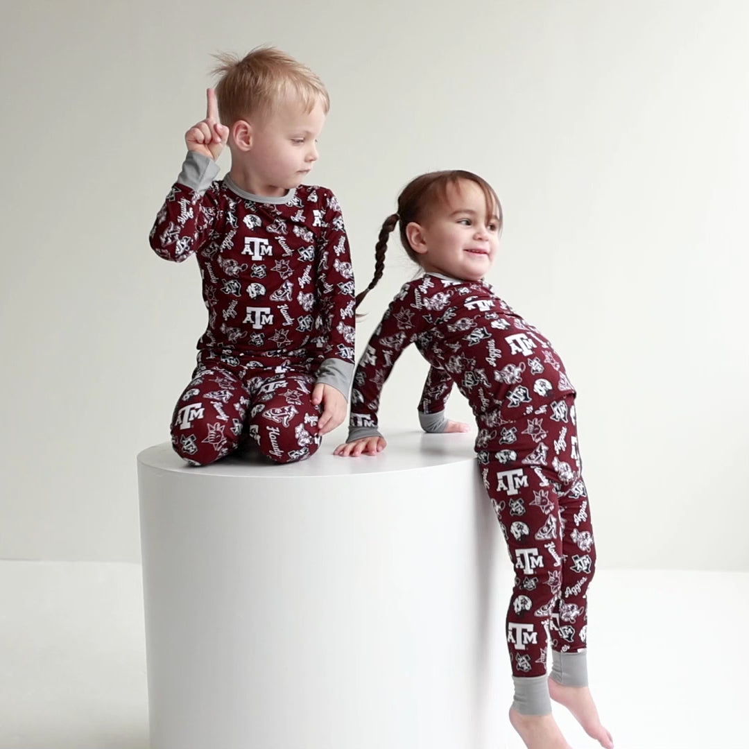 Texas A&M Aggies zippy one-piece sleeper and two-piece pajama set shown together for little Aggies fans