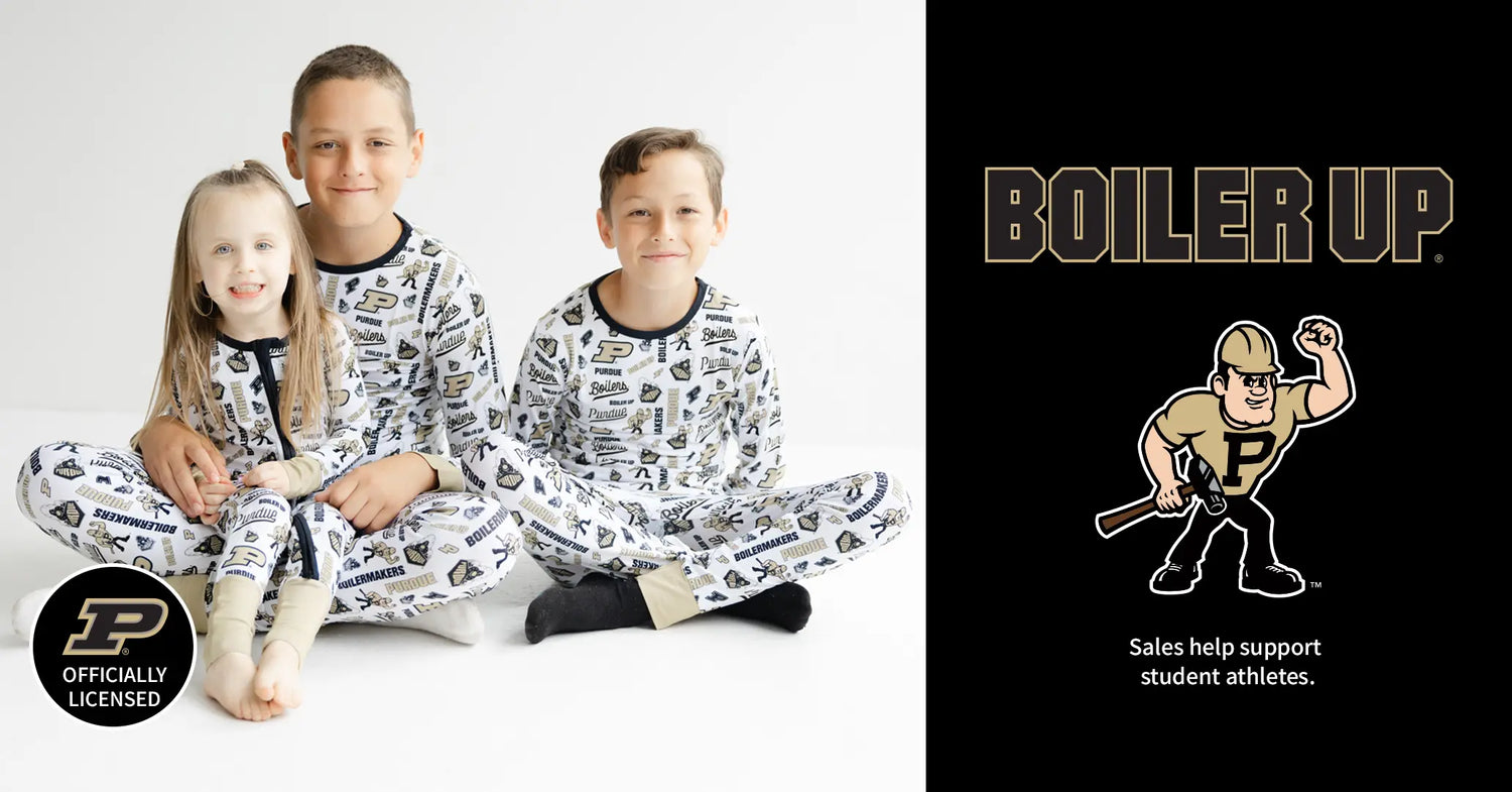 Children wearing matching pajamas with a 'Boiler Up' logo on the right side.