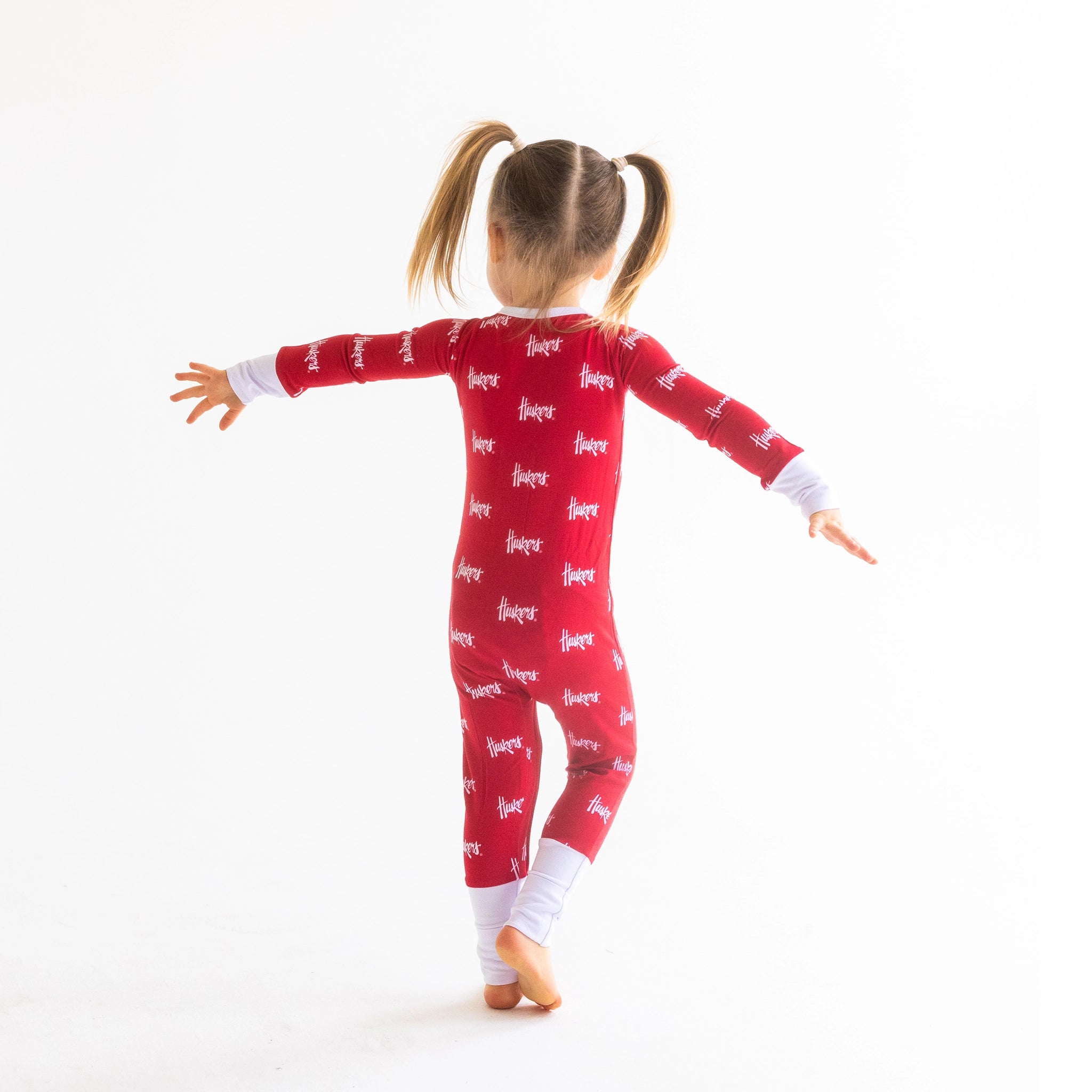 Nebraska Cornhuskers Double zipper baby Onesie for quick diaper changes.