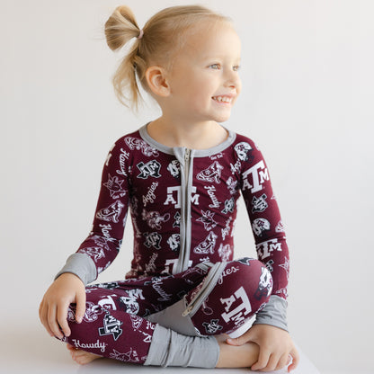 Front view of a toddler girl's Texas A&M Aggies sleeper showing the two-way zipper