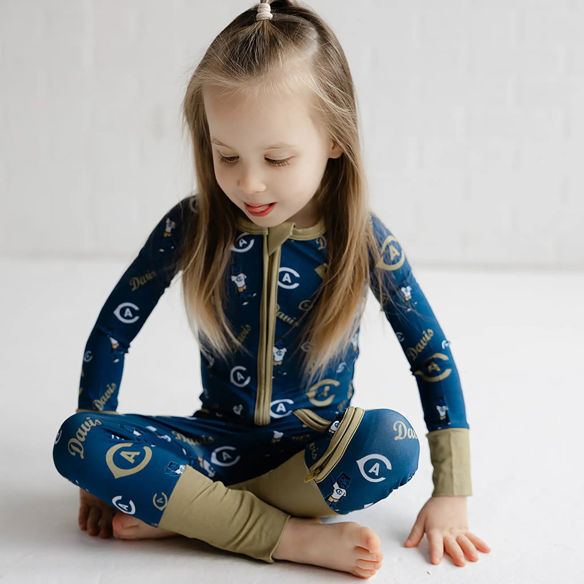 UC Davis Aggies bamboo footed sleeper in blue with officially licensed collegiate branding.