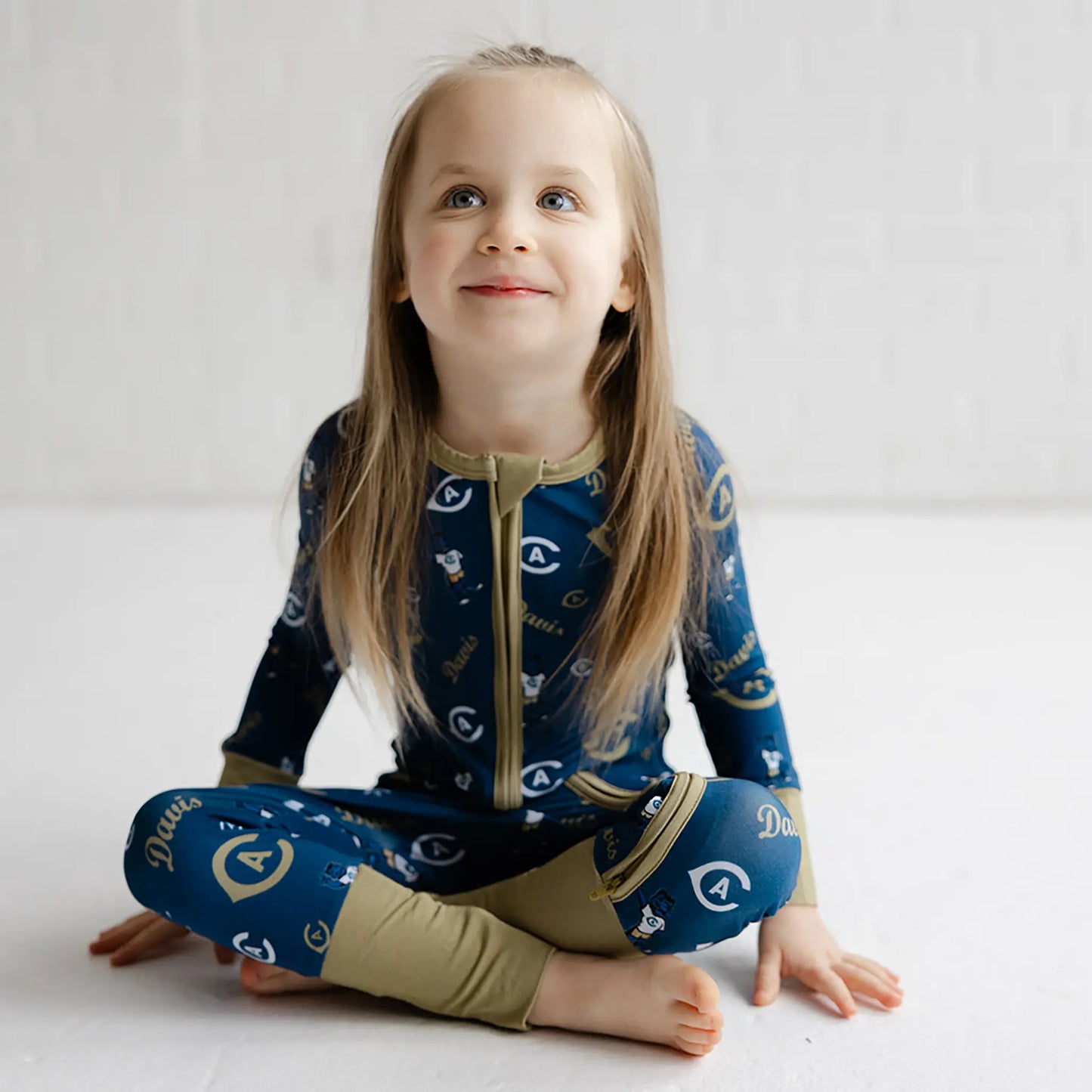 Front view of UC Davis Aggies bamboo zippy one piece in official blue team color.