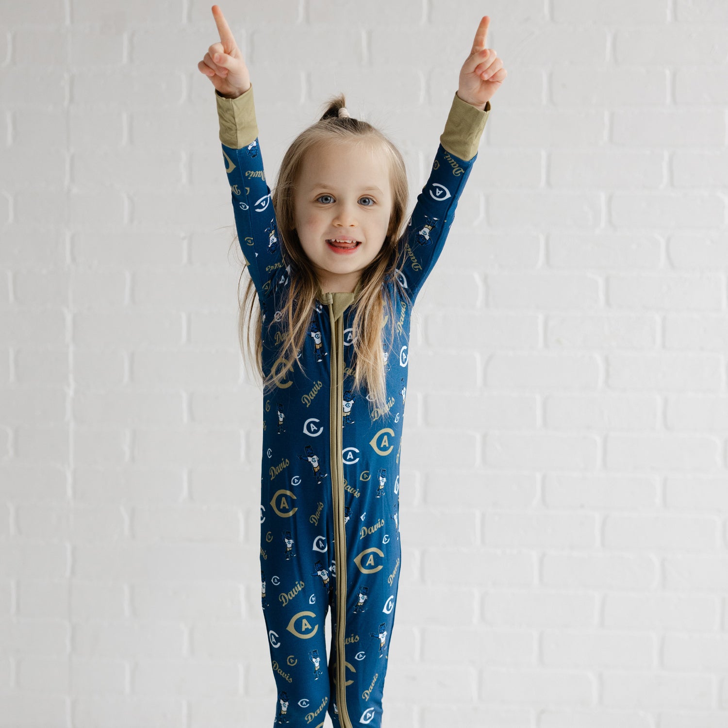 UC Davis Aggies bamboo zippy pajamas for babies with blue and gold team branding