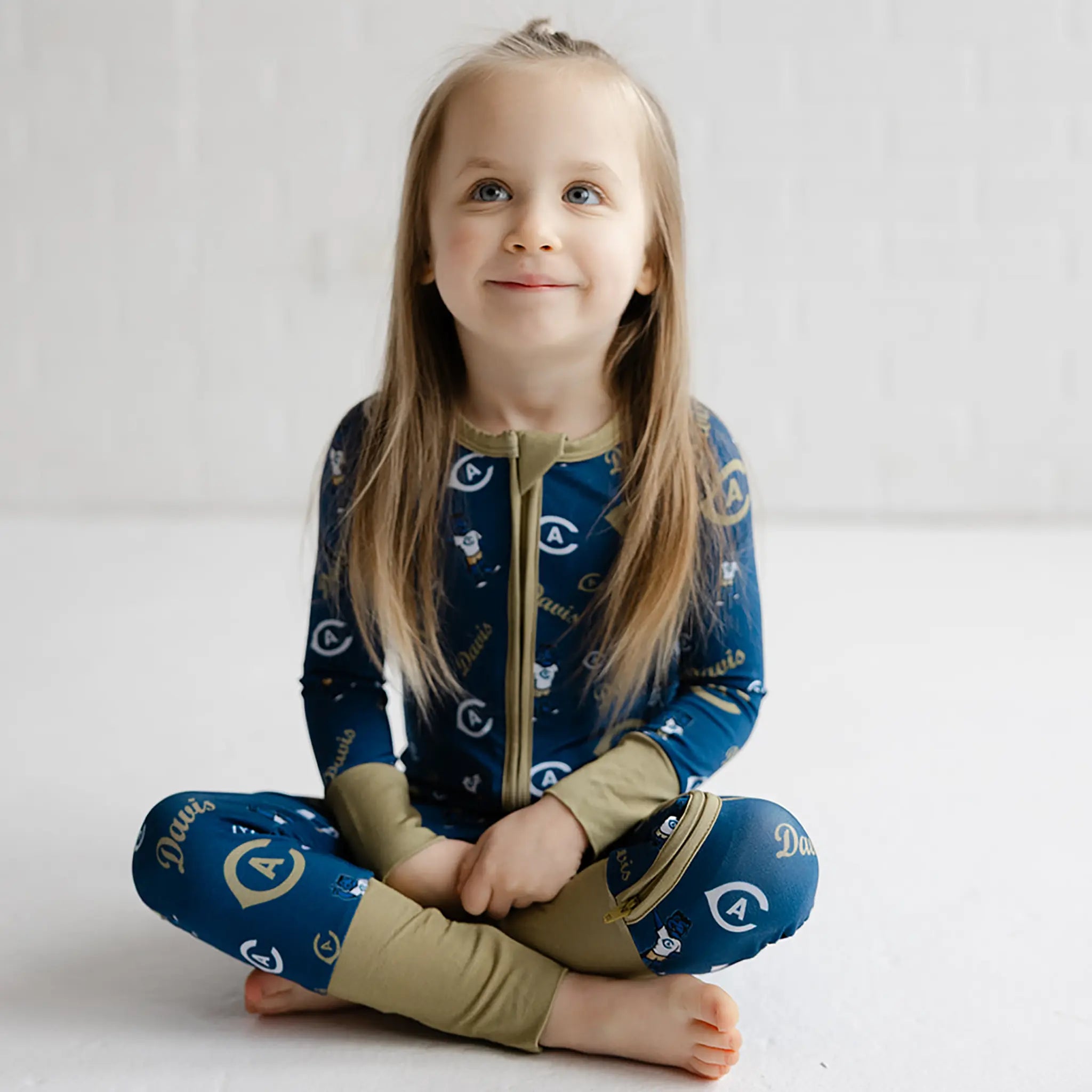 UC Davis Aggies double zip bamboo onesie for infants and toddlers in breathable bamboo fabric.