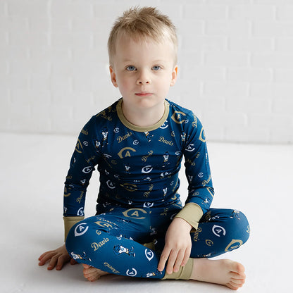 Long sleeve UC Davis bamboo pajamas for kids featuring official Aggies logos in blue and gold.