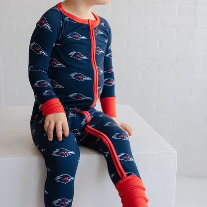 A child wearing a navy UTSA roadrunners bamboo zipper one piece sleeper.