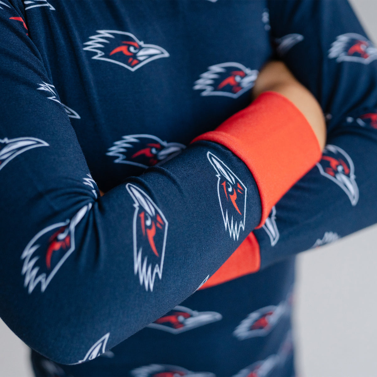 A close-up of a youth wearing utsa roadrunners bamboo two piece pajama set.