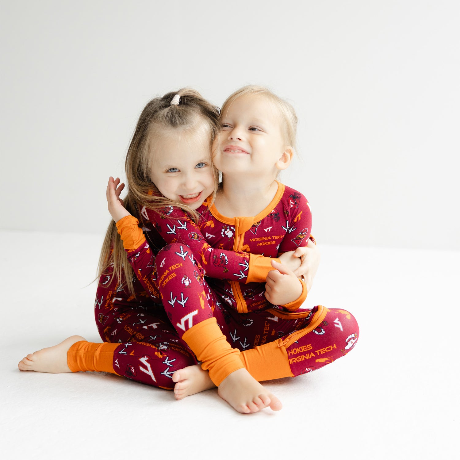 Baby Virginia Tech Hokies game day sleeper in Chicago Maroon with Burnt Orange trim.