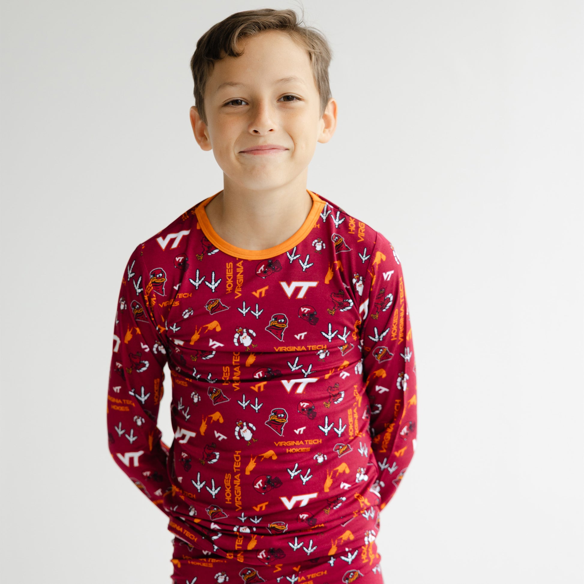 Virginia Tech Hokies two-piece bamboo pajama set with Chicago Maroon background and Burnt Orange trim.