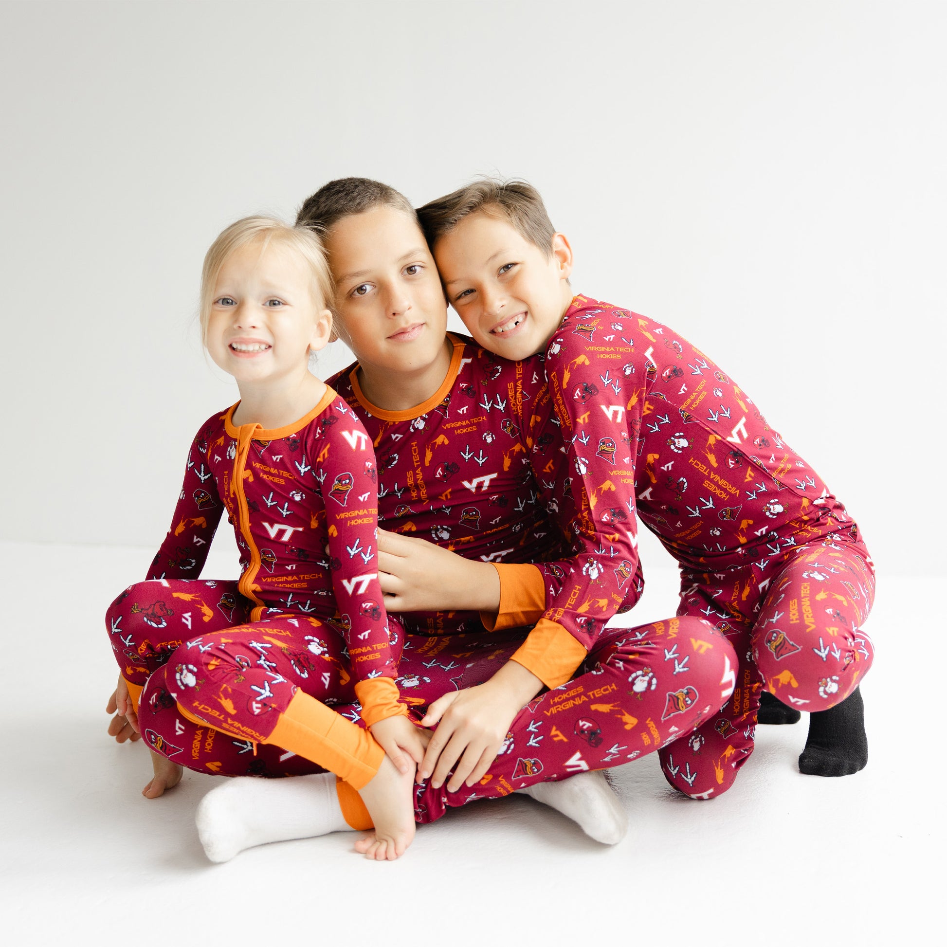 Virginia Tech Hokies youth pajama set with bold maroon and orange team-inspired design.